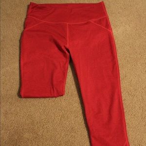 Bright red Fabletics cropped leggings.